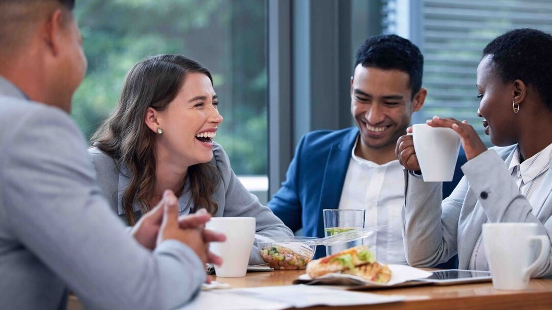 Colleagues laughing together