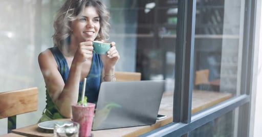 Woman at desk with coffee