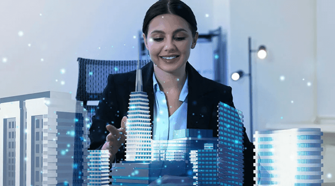 Woman looking at building models