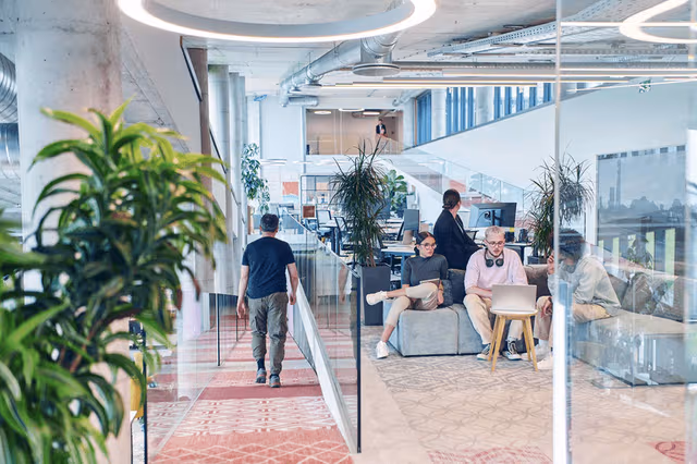 webimage-In-a-modern-startup-office-a-diverse-group-of-young-professionals-collaboratively-tackles-various-business-problems-and-challenges-surrounded-by-their-engaged-colleagues-fostering-innovation-and (1)
