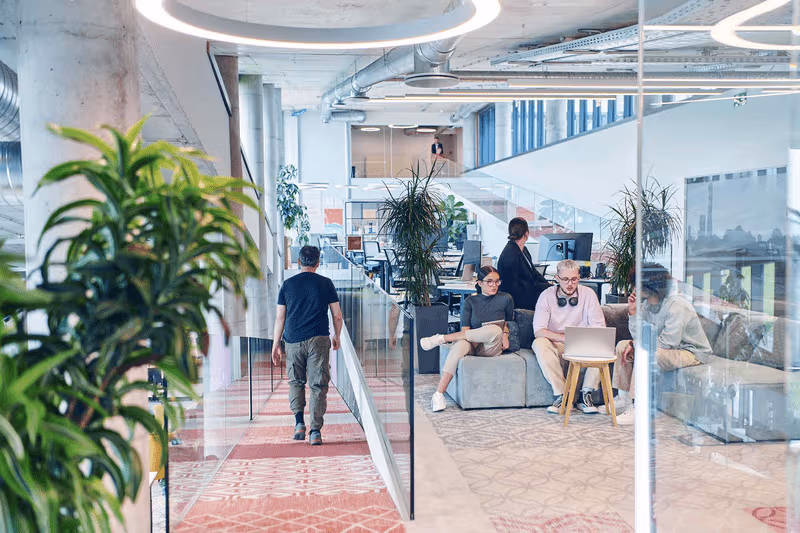 webimage-In-a-modern-startup-office-a-diverse-group-of-young-professionals-collaboratively-tackles-various-business-problems-and-challenges-surrounded-by-their-engaged-colleagues-fostering-innovation-and